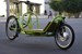 En grön tvåhjulig cykel med lastutrymme framför styret