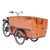 Trehjulig cykel med mycket stor låda fram