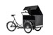 En trehjulig lastcykel med stor låda fram.
