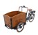 En trehjulig elcykel med stor trälåda fram. 